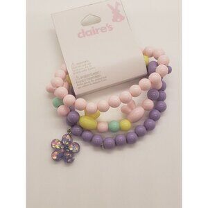 Claires Set Of 3 Stretchy Pastel Easter Charm Bracelets Pink Purple Bunny Charm